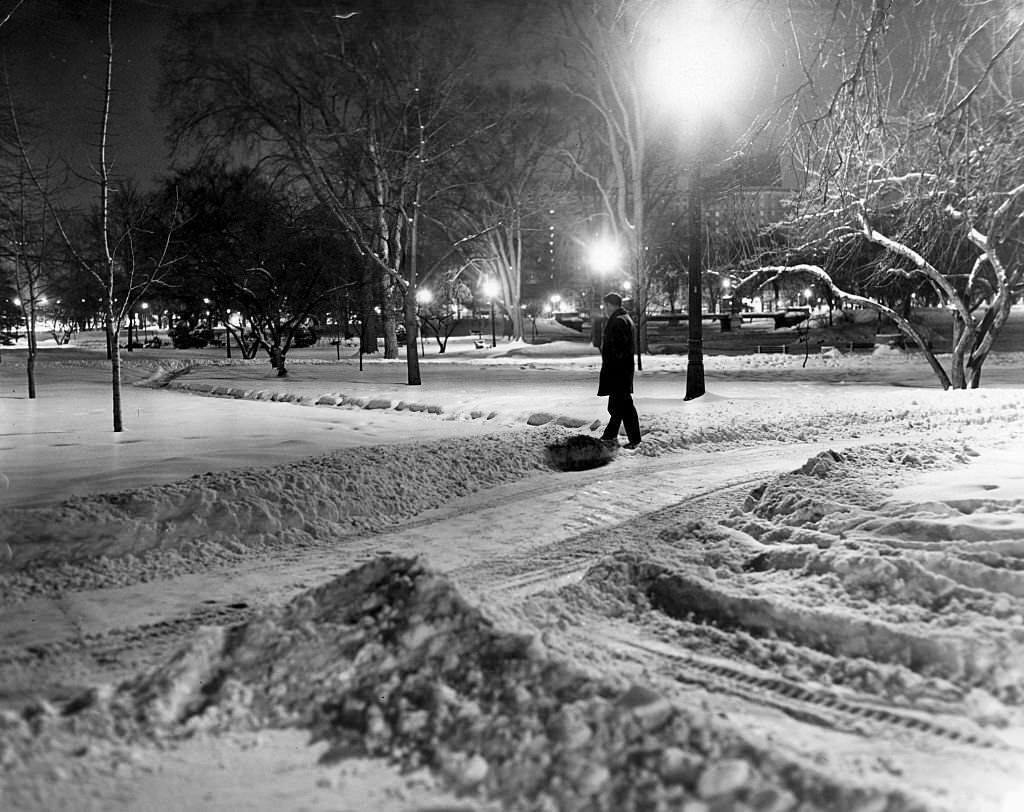 A pedestrian walks through the snow in the Public Garden in Boston at 4 a.m. on Dec. 28, 1963.