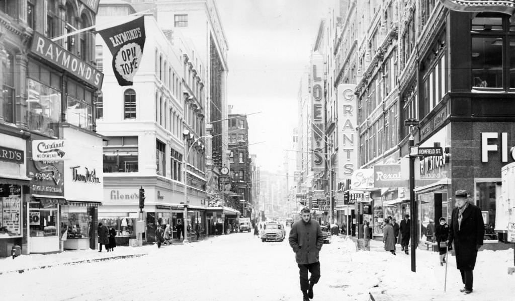 People walk down a snow covered Washington Street in Boston, 1960.