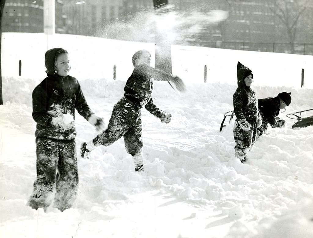 A fierce snow battle in progress at the Public Garden in Boston during a break in sledding.