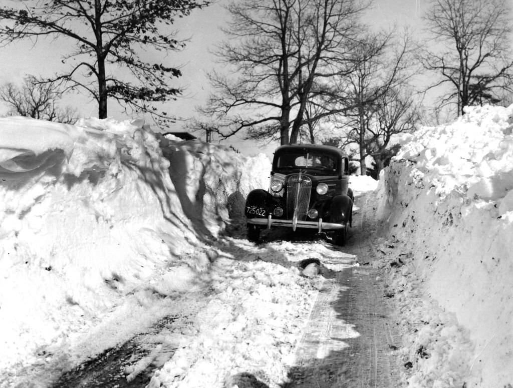 Snow is higher than the tops of cars in places along Route 27 in Medfield, 1940.