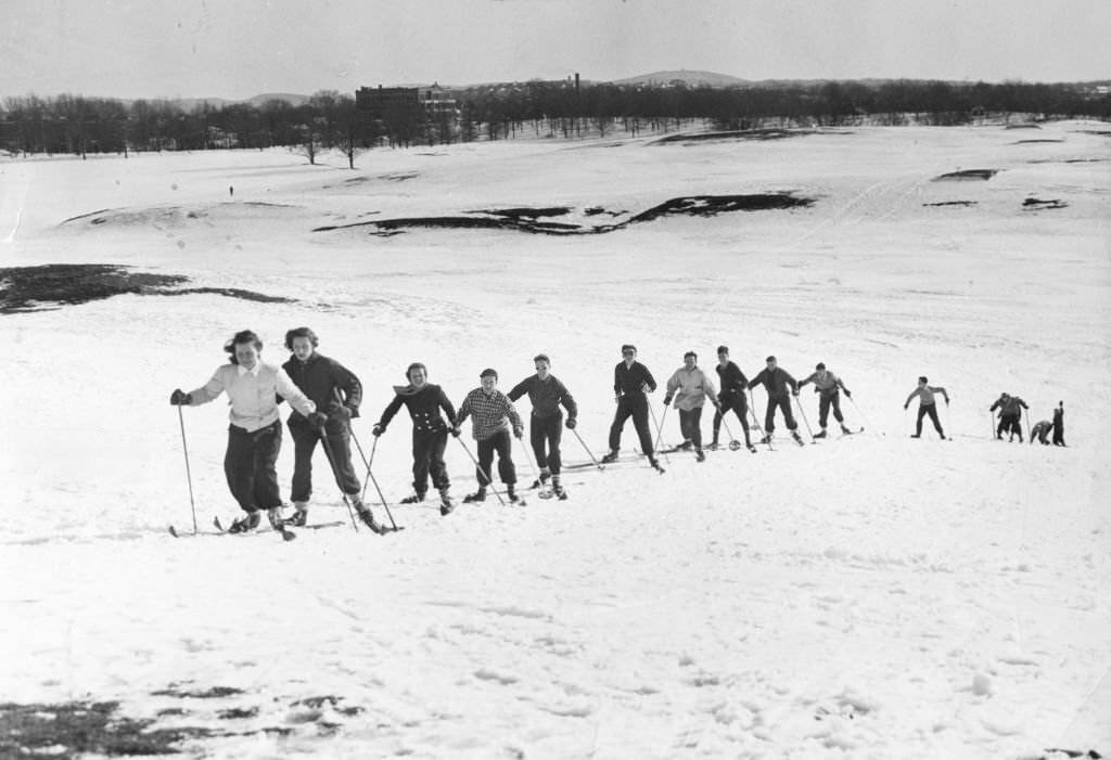 Ski enthusiasts take advantage of heavy snowfall to enjoy the slopes at Franklin Park in Boston in March 1939.