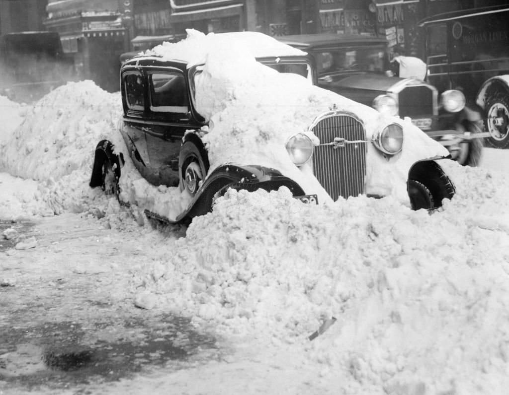 A car is covered in snow in Boston, Jan. 23, 1935.