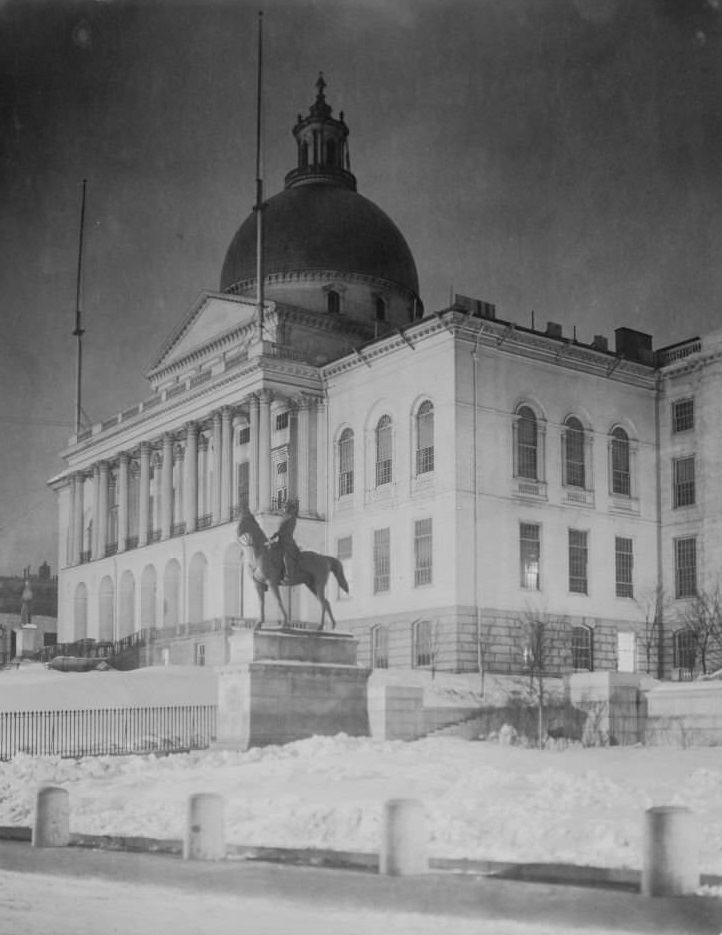Front right view of State House, equestrian statue in foreground, snow on ground, Boston, Massachusetts, 1906. (
