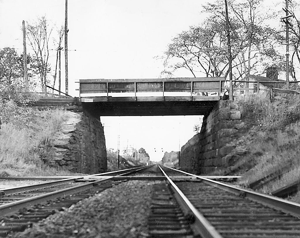 Old wooden bridge over boston & maine railroad tracks in scarborough. black point road