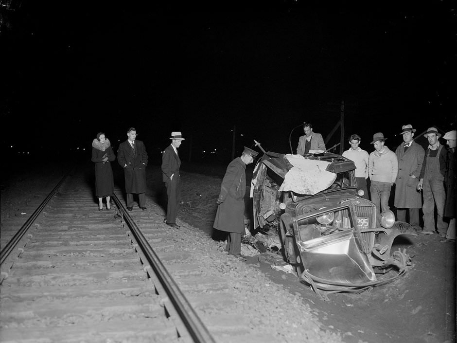 Auto hit by train kills two. Belmont, 1933