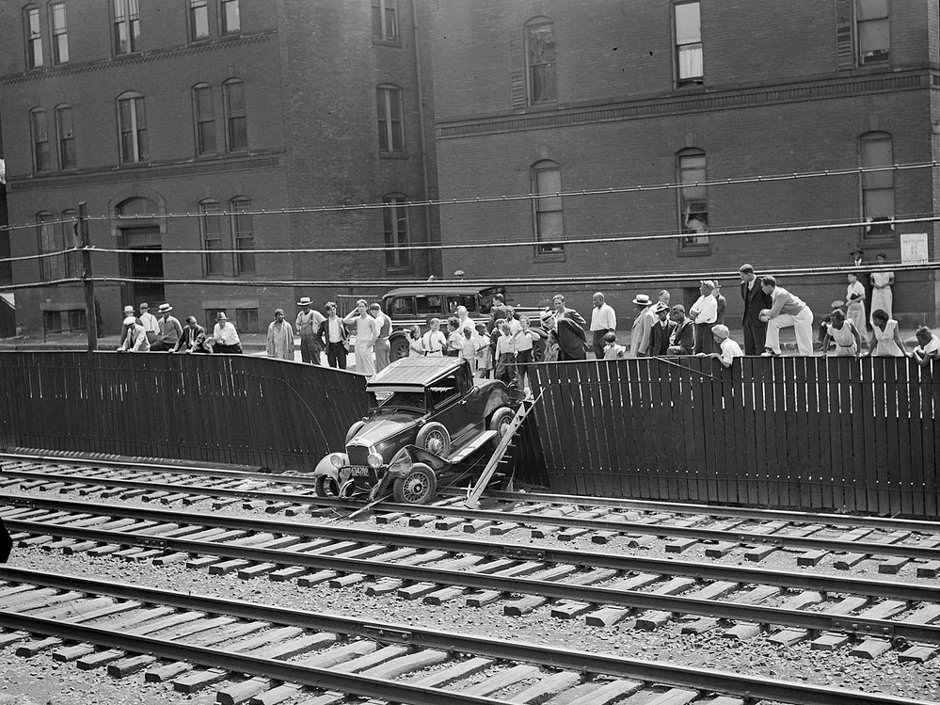Auto goes out of control and crashes through fence onto B&A Tracks near Greenwich Park, South End, 1934