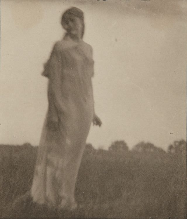 Woman in landscape, Maine, 1910