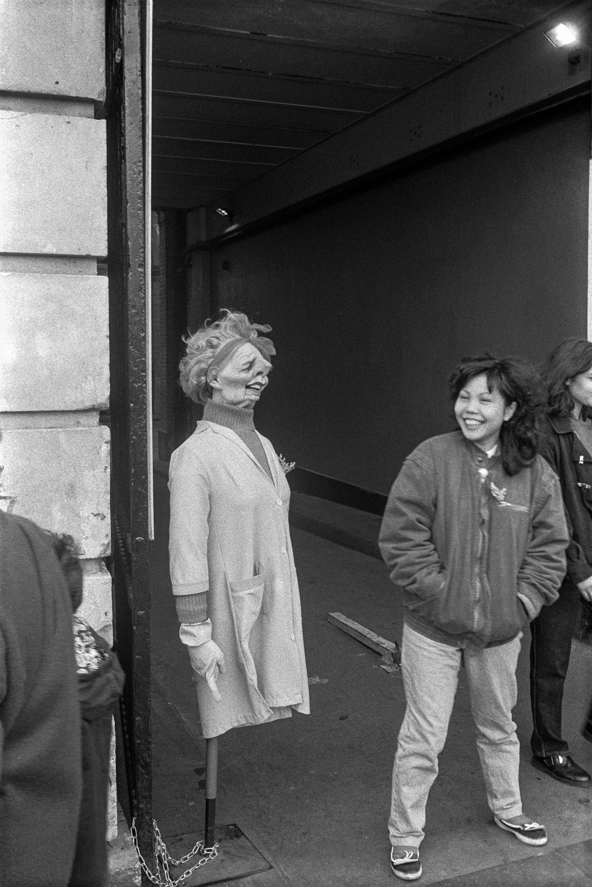 Woman and model of Margaret Thatcher, 1991