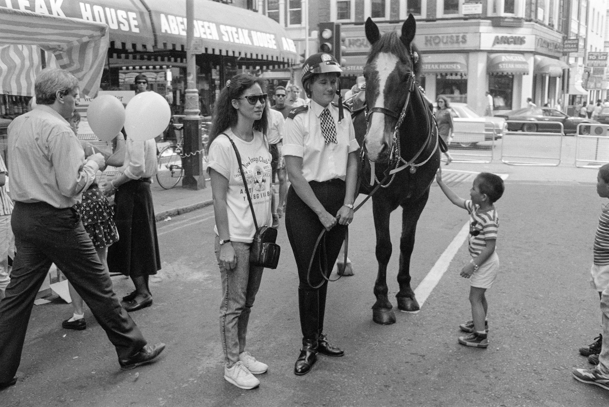 Tourist poses with policewoman and horse, Covent Garden, Westminster, 1990