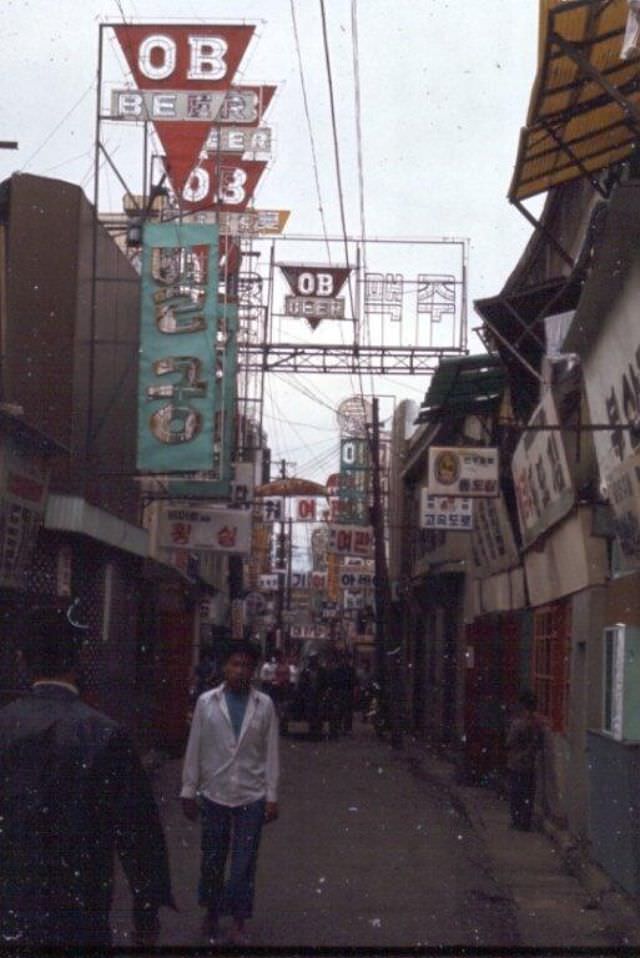 Restaurant and bar district in downtown Tague, 1970s