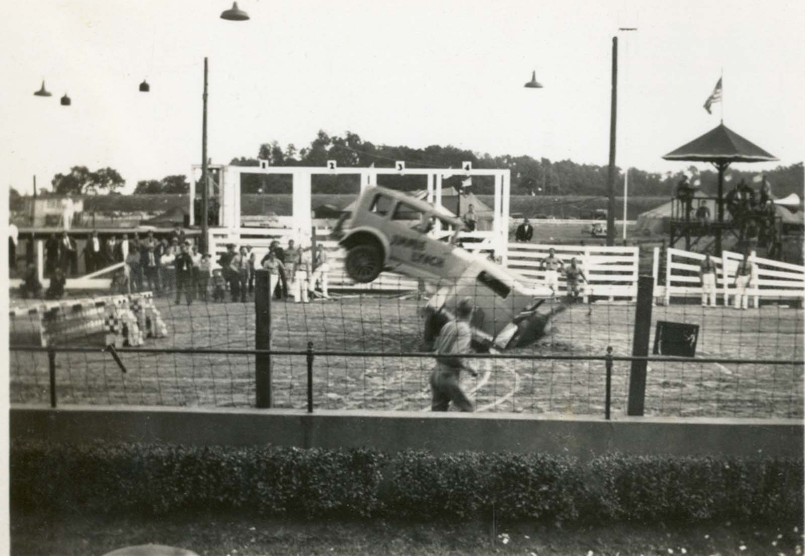 A jumping car fails to clear another car parked in front of it and crashes into it at the Rutland Fairgrounds.