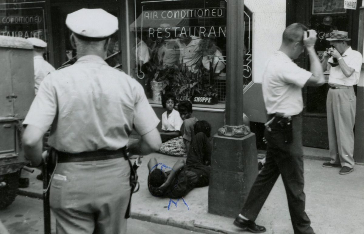 On July 26, 1963, student protesters on Main Street in Farmville stage a sit-in outside the College Shoppe restaurant, which refused to serve black patrons.