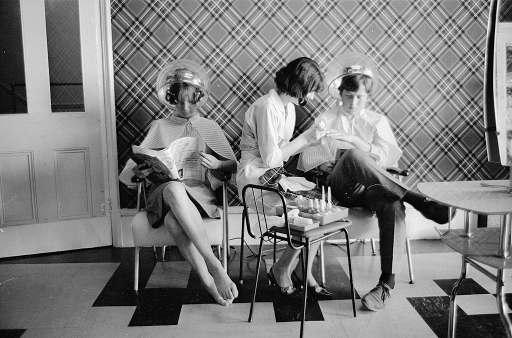 Young people in the beauty parlour of the 'Caribbean Hotel' which caters especially for teenagers on holiday in Bognor Regis, Sussex, 1965