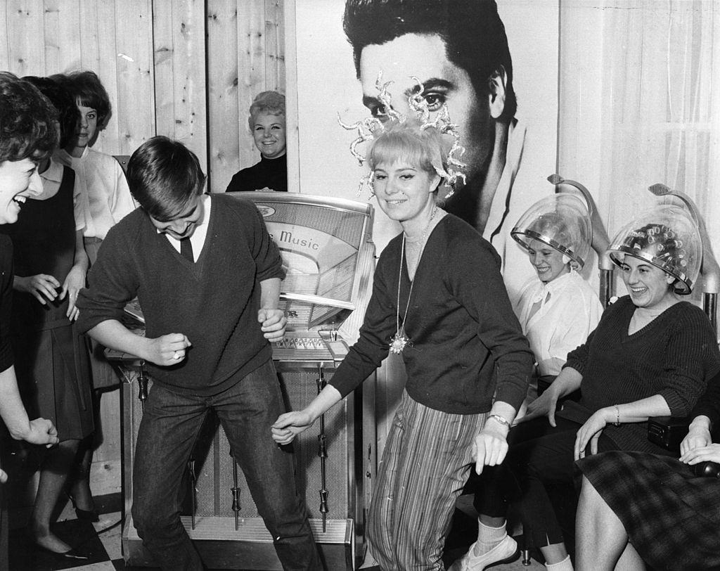 Young people dancing at a hairdressing salon opened by John French at Egham, Surrey, which caters exclusively for teenagers, 1962