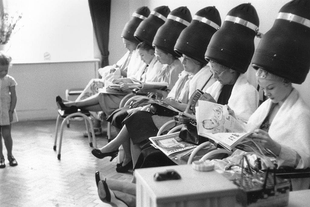 Six women, with Gloria Nord (right), star of Tom Arnold's Ice Circus in Brighton, under the driers at the hairdressers, 1952