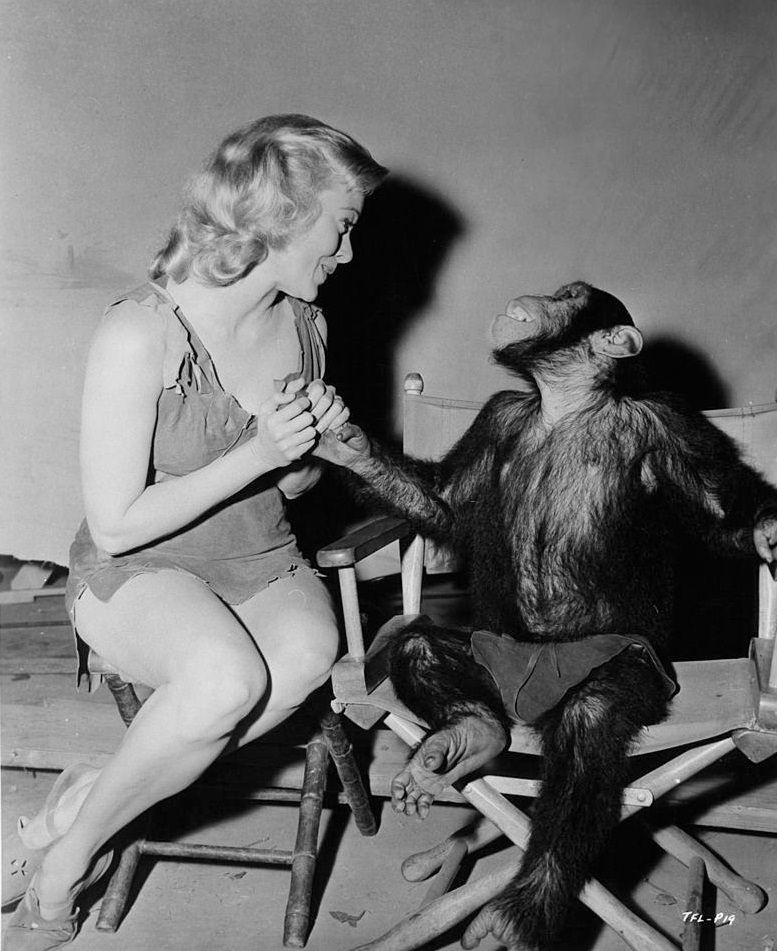 Eve Brent and Cheta the chimpanzee ham it up in between scenes of the film 'Tarzan's Fight For Life', 1958.