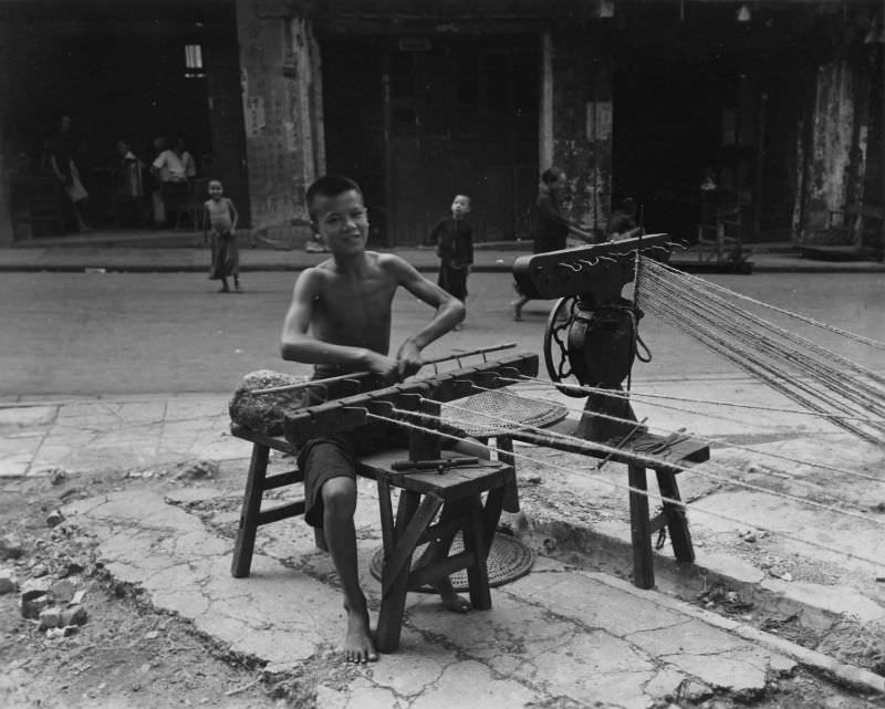 Chinese boy making rope, Hong Kong, August 1945