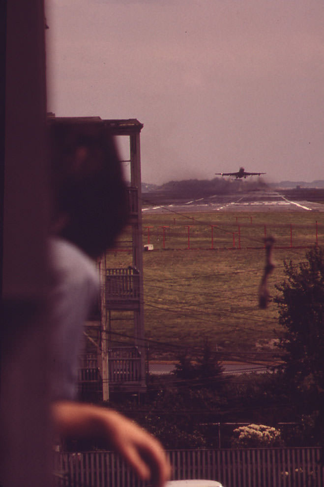 From the Rear Porch of His Home at the Southern Corner of Neptune and Lovell Streets, Larry Vienza Watches Jet Take Off from Runway 15r-33l.