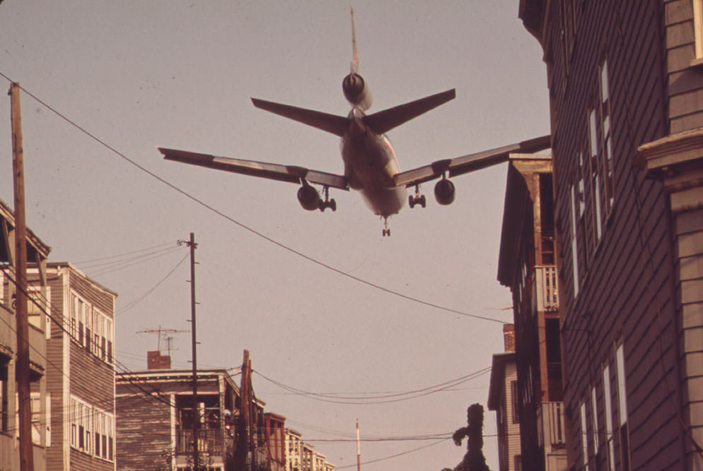 Near Logan Airport - Airplane Coming in for a Landing Over Neptune Road Homes, 1973