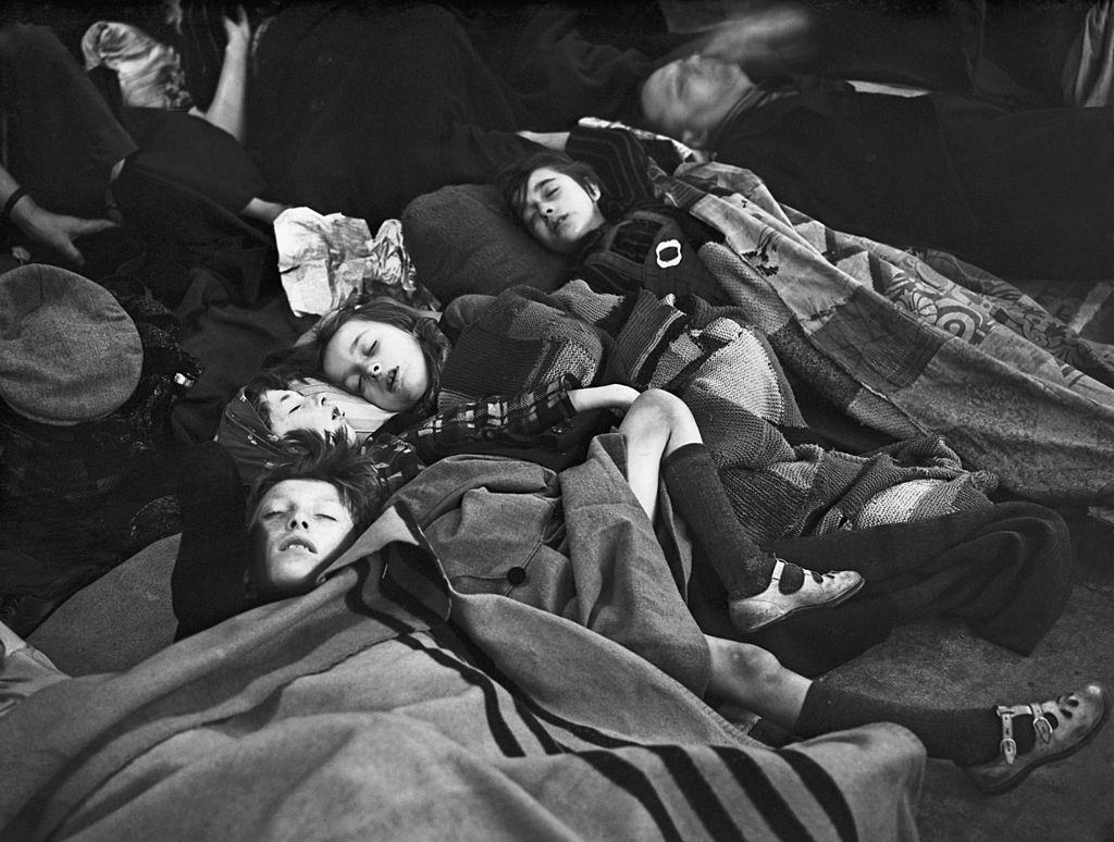 Children sleeping on a platform at a London Underground station, where they have taken shelter during one of the nightly bombing raids of the London Blitz,18th October 1940.
