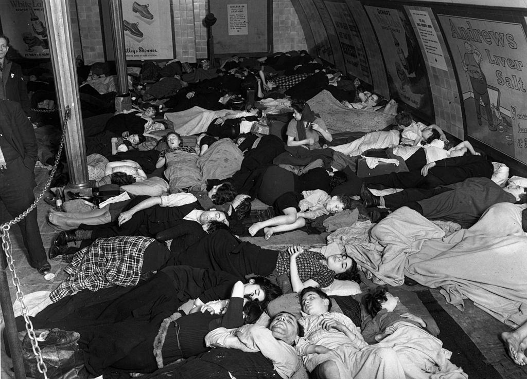 Because of the nightly bombing raids, many people from the more densely populated parts of London sleep in underground stations for safety.