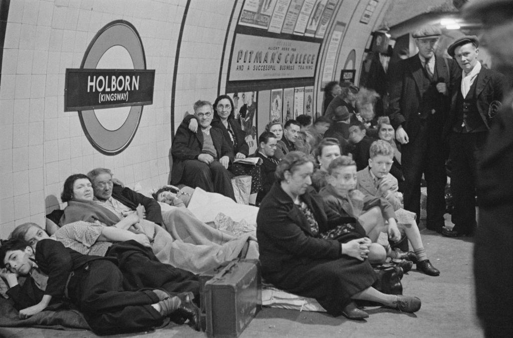 Wartime scene as Londoners seek shelter and bed down on the platform at Holborn underground station.