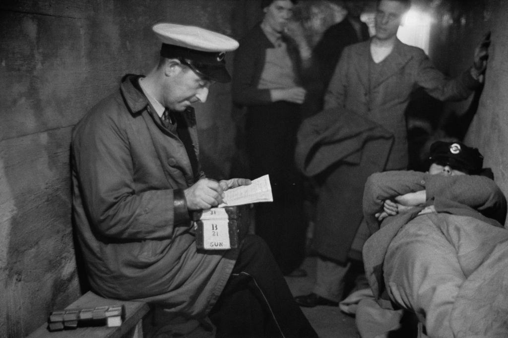 A group of people in an air raid shelter during the Blitz, London, October 1940.