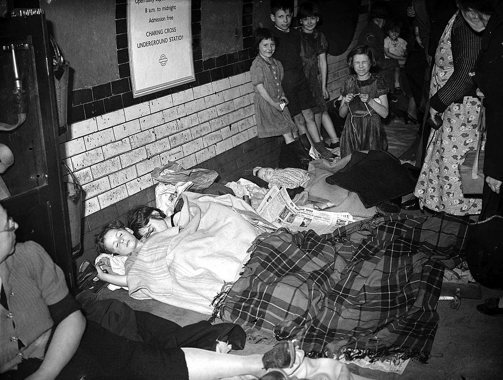 Members of the public huddle together in a London underground station, 1940