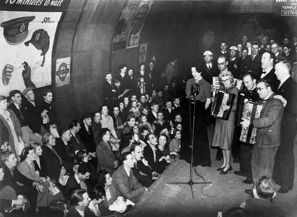 Musicians entertaining Londoners as they shelter from German air raids at Aldwych tube station in central London, 1940