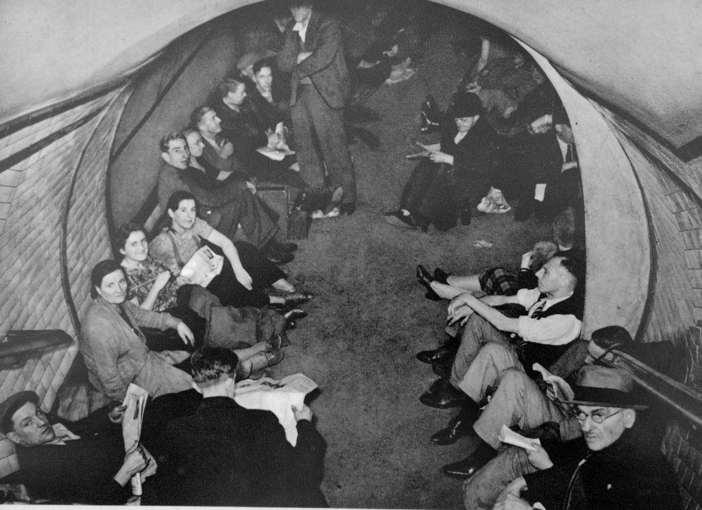 Civilians take shelter in a London Undergroud rail station during the air raids of the German Blitz, 1940