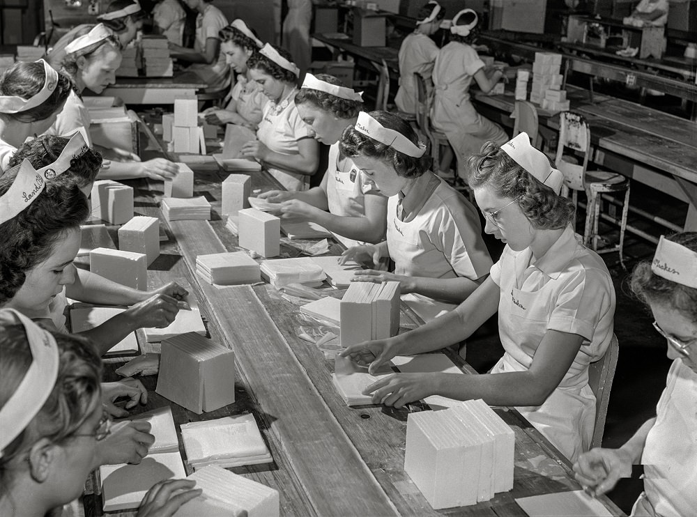 Workers packing butter cut into squares for use in restaurants at Land O'Lakes plant, Minneapolis, Minnesota, July 1941