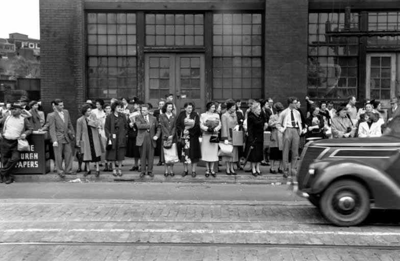 Waiting for a streetcar in downtown Pittsburgh, 1950