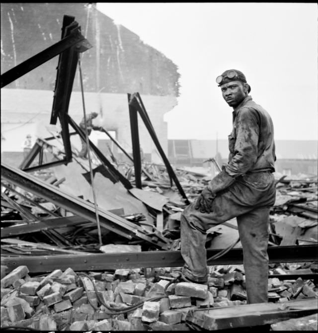 Workman on wrecking project at the Point, 1950