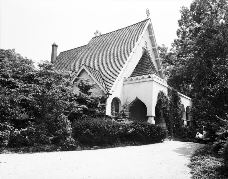 June 1945. An ornate entry off the driveway and an unusual weather vane on the peak characterize this unique house