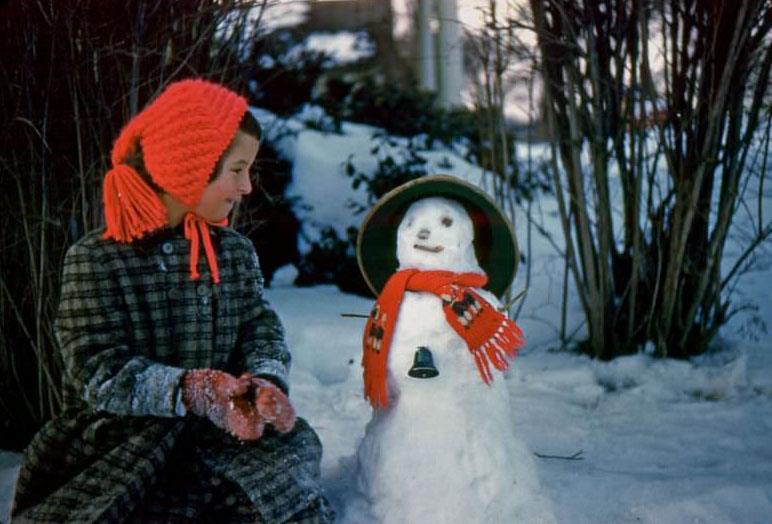 Diane and snowman, circa 1959
