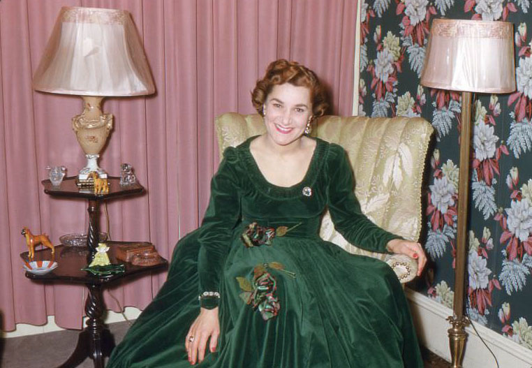 Woman in green dress, USA, 1950s