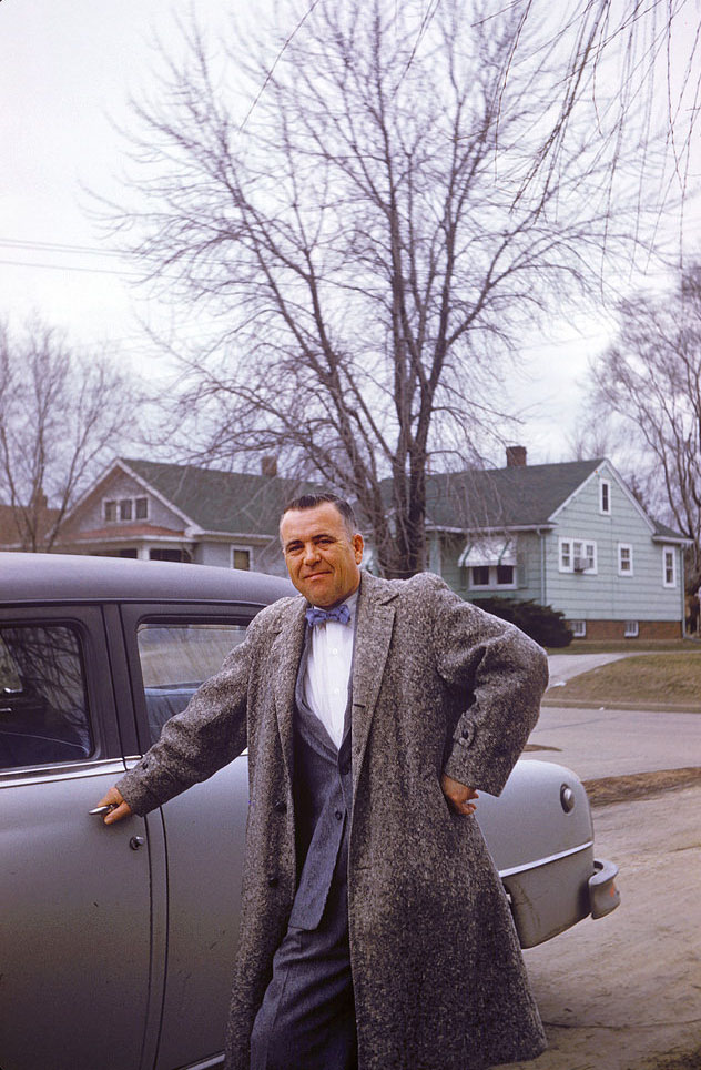 Man poses with his car, Peoria, Illinois, 1957