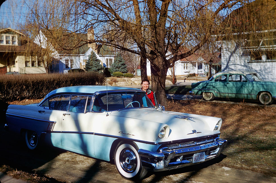 Woman poses with her 1956 Mercury, Peoria, Illinois, 1957