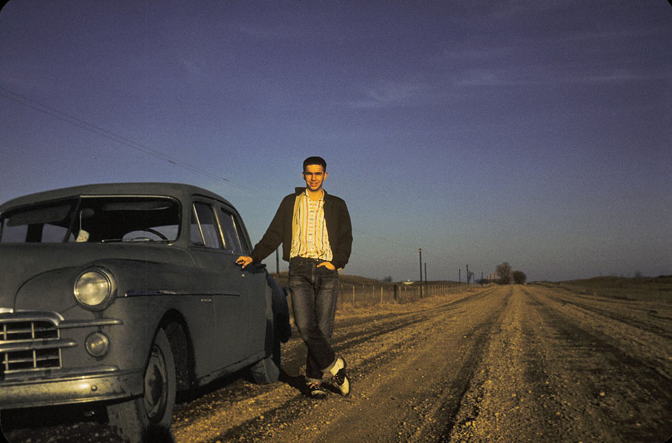 Boy poses with his 1949 Dodge in Peoria, Illinois, 1957