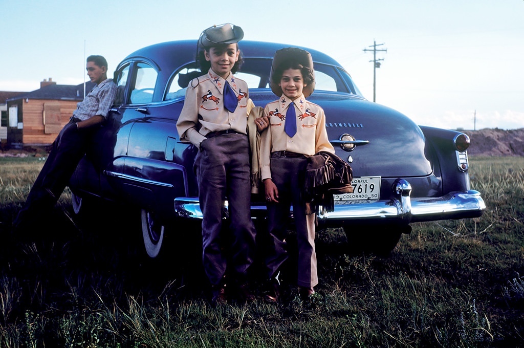 Couple of cowgirls waiting for their horses, Cheyenne, Wyoming, 1950