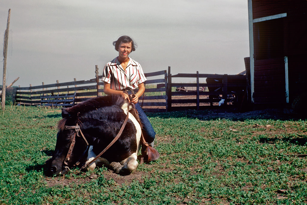 Girl riding on horseback, South Dakota, 1950