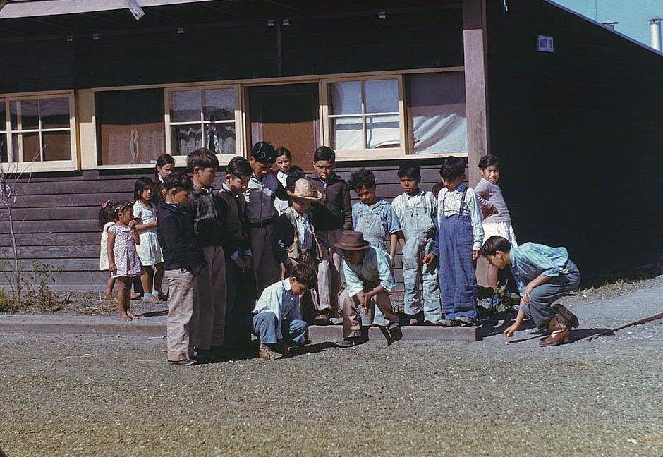 Boys playing marbles, FSA labor camp, Robstown, Texas, 1950s