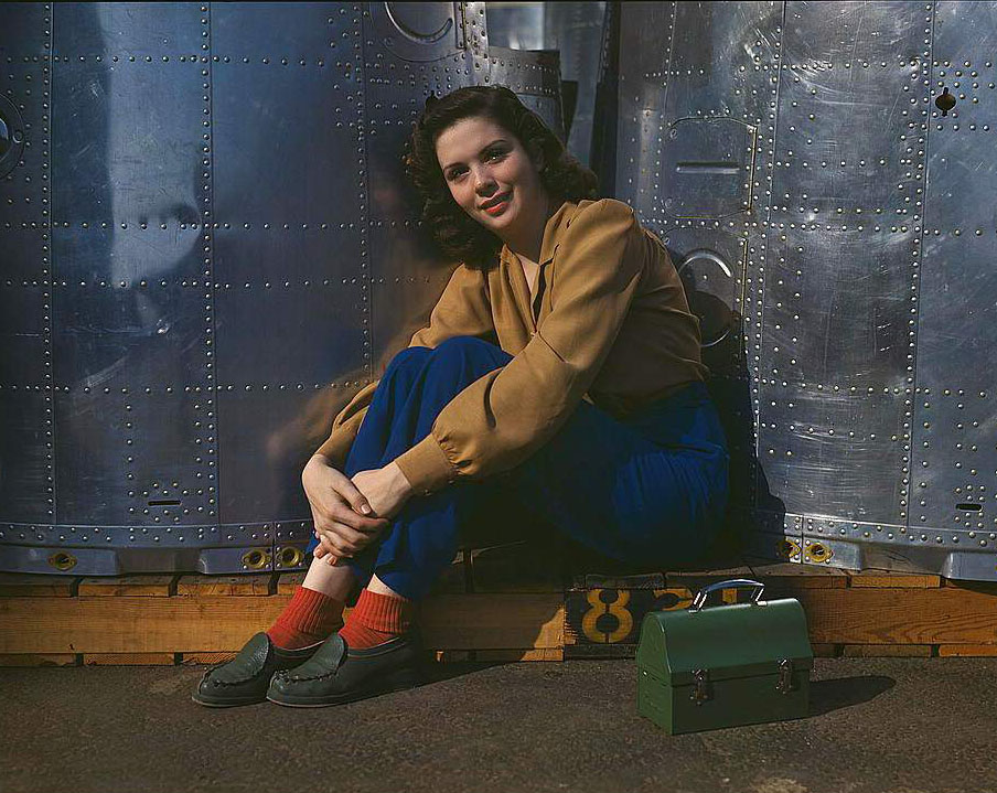 A noontime rest for a full-fledged assembly worker at the Long Beach, Calif., plant of Douglas Aircraft Company. Nacelle parts for a heavy bomber form the background, 1950s