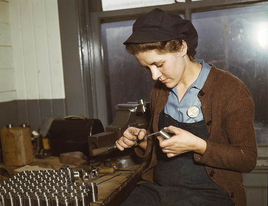 War production workers at the Vilter [Manufacturing] Company making M5 and M7 guns for the U.S. Army, Milwaukee, Wis. Ex-housewife, age 24, filing small parts, 1950s