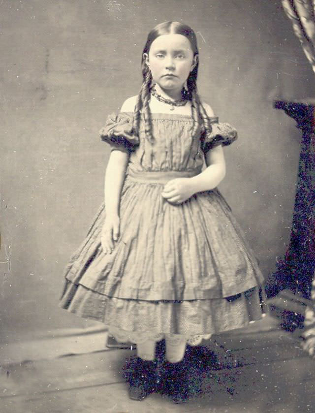 Little girl standing in a corner