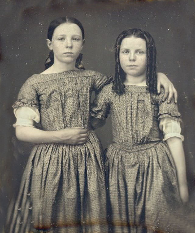 Two lovely young ladies in matching dresses