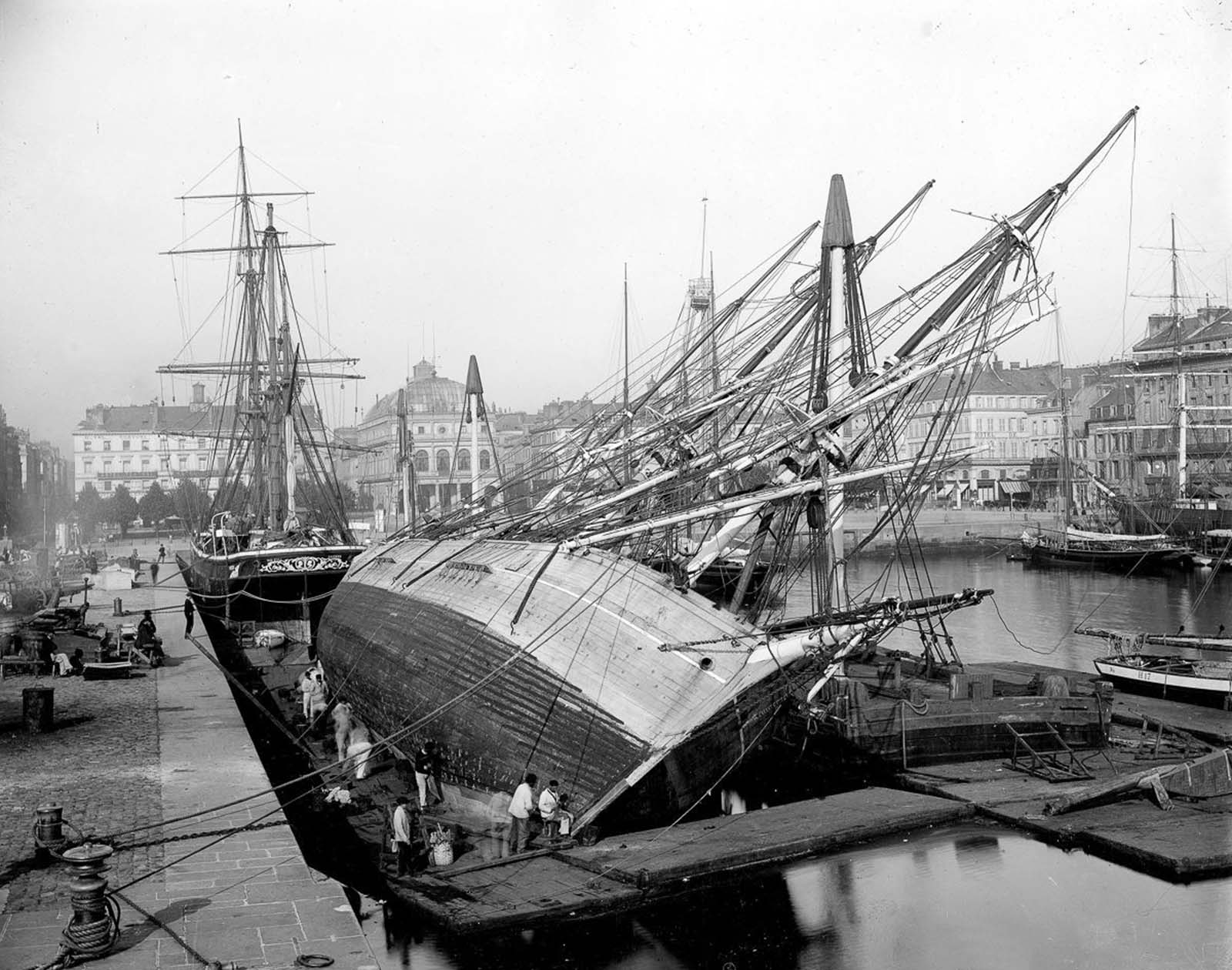 A ship’s hull is repaired in dry dock in France, 1890.