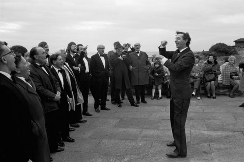 A male voice choir practising on the seafront at Porthcawl during the Miners' Eisteddfod