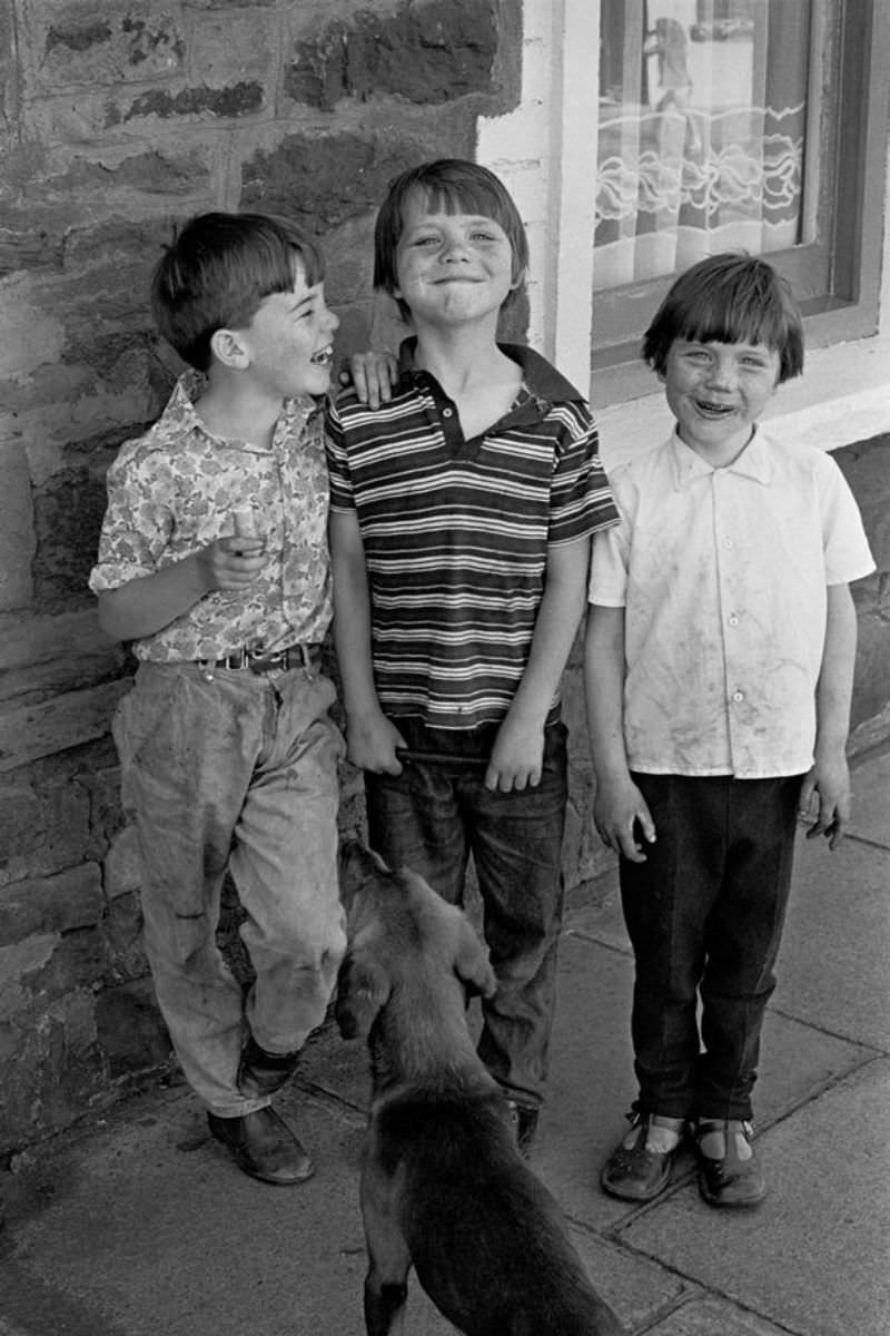 Children smile for the camera in Dowlais