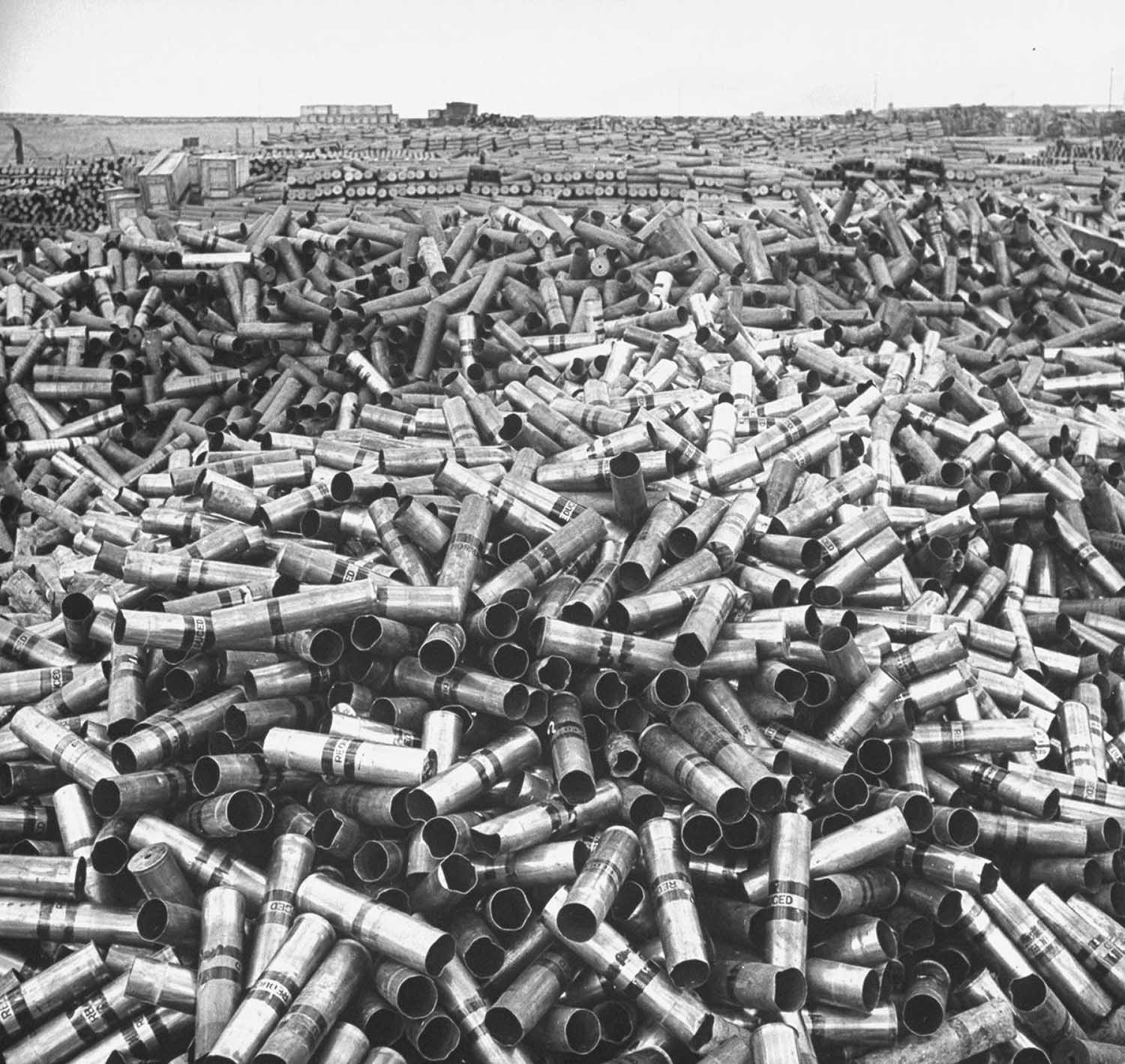 18 million pounds of scrap brass is piled up at a U.S. Army depot storing unused equipment, 1946.
